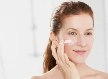 Bioderma - woman applying cream on the face